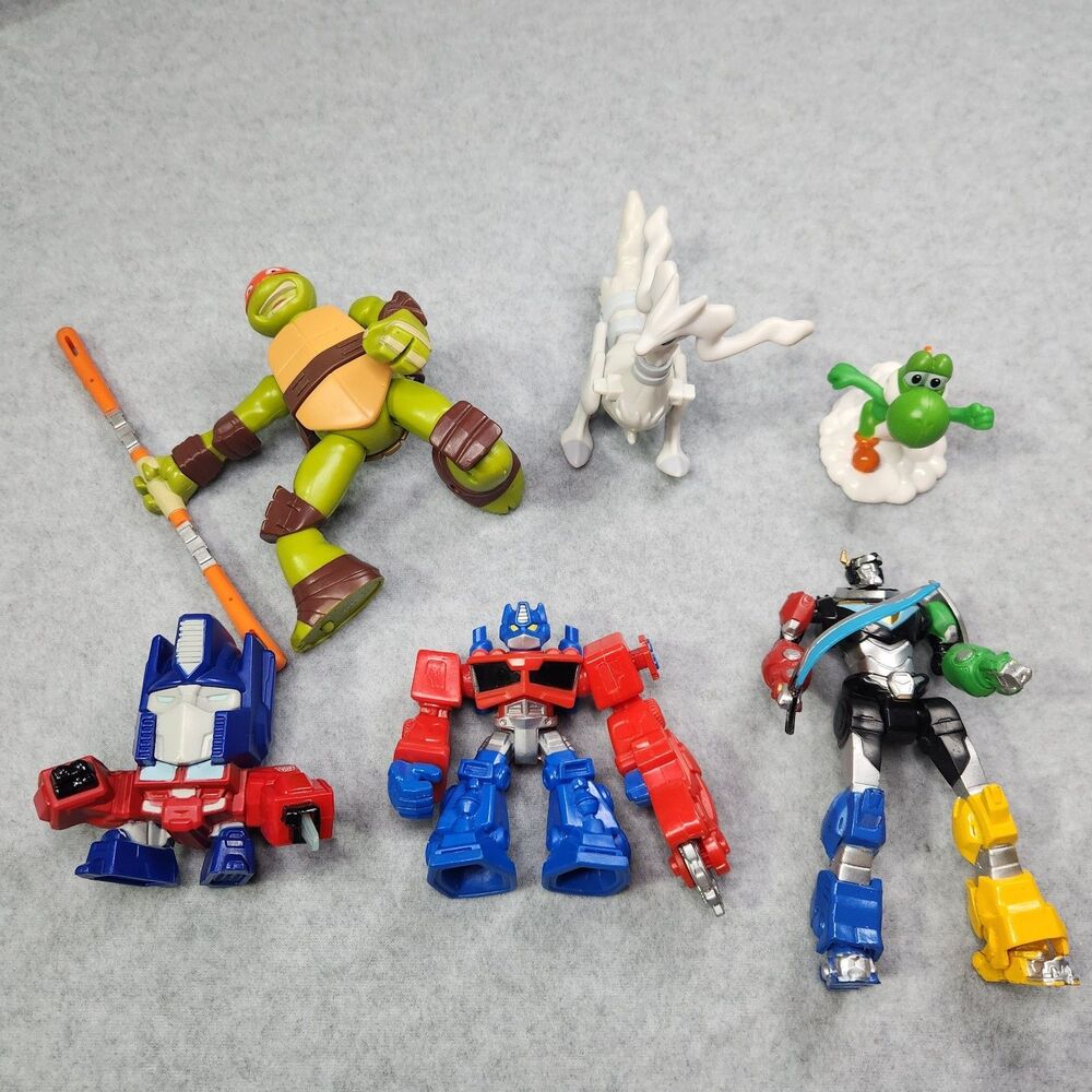 Mixed Action Figure Lot - Transformers Optimus, TMNT Raphael, Voltron, Pokemon